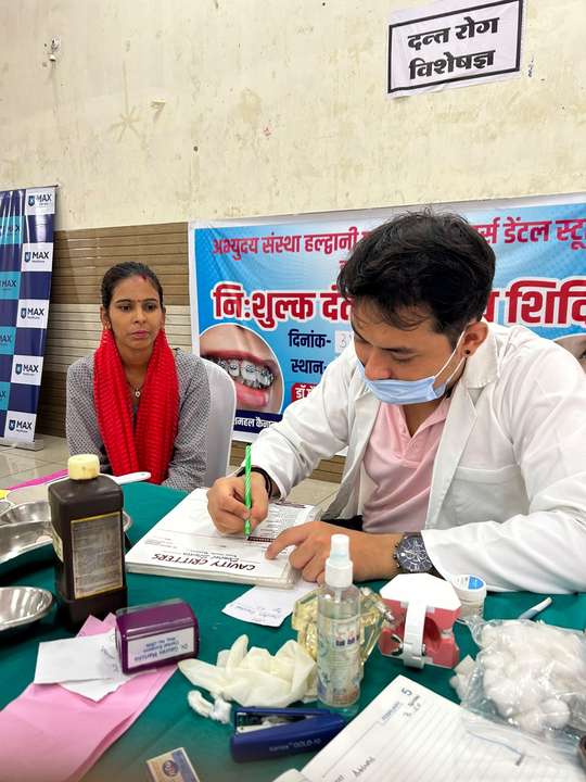Recording findings at the free dental check-up camp