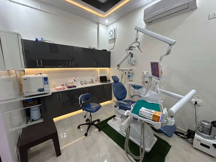 Modern dental chair and sterilisation counter in the treatment room