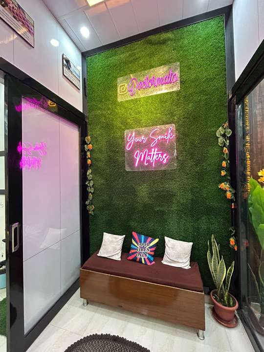 The neon 'Your Smile Matters' wall in the waiting area