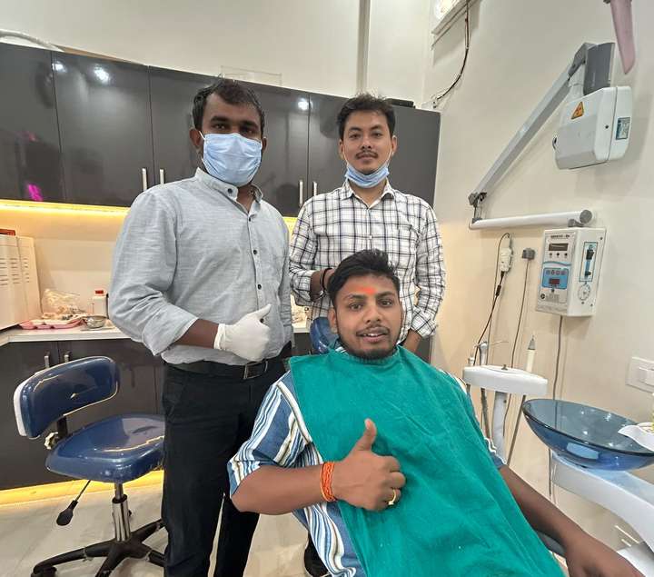 The Cavity Critters team with a happy patient
